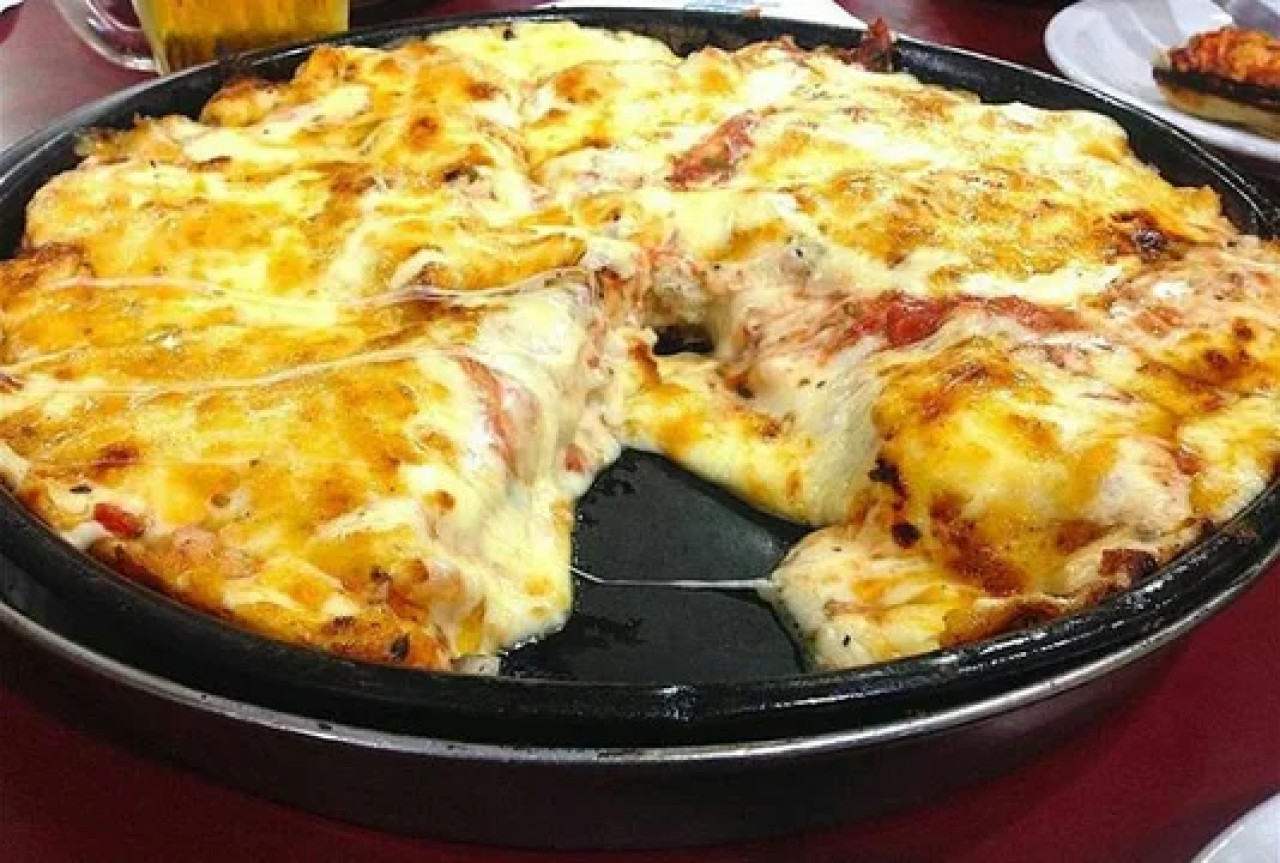 Pizza de muzzarella. Foto: NA