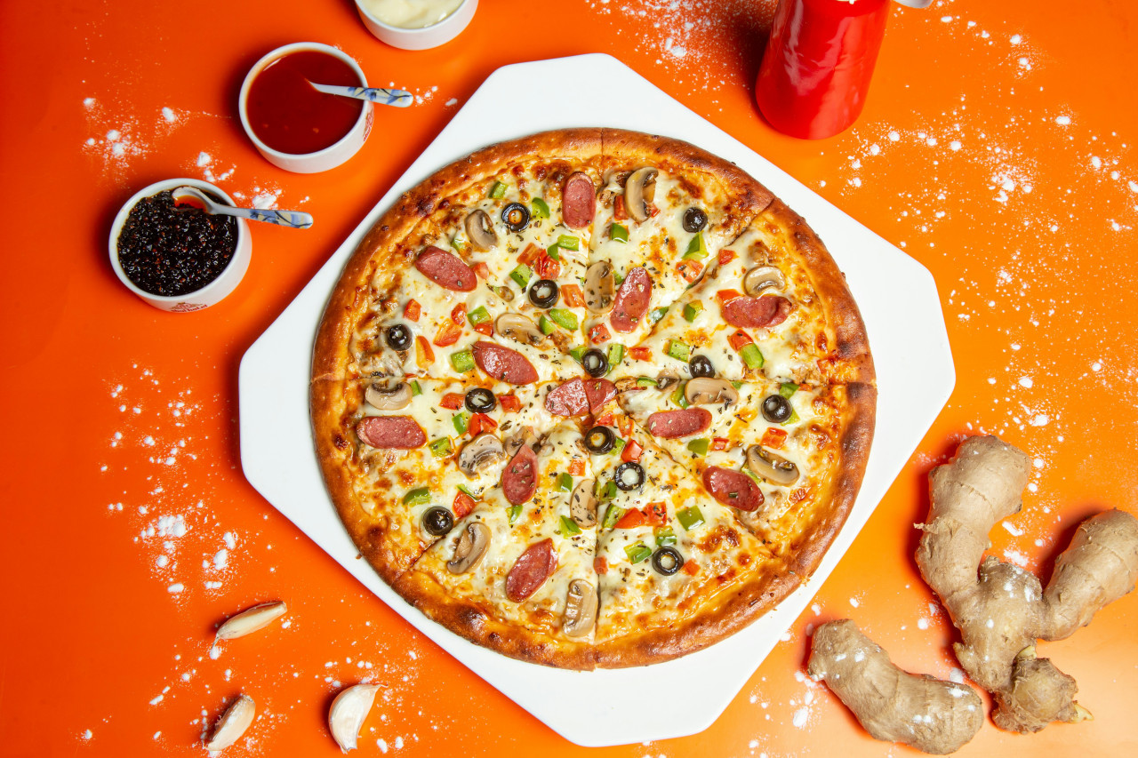 Pizza, pizzería. Foto: Unsplash.